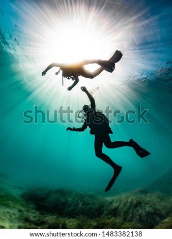 diver silhouette at the end of a dive Royalty-Free Stock Photo #1483382138