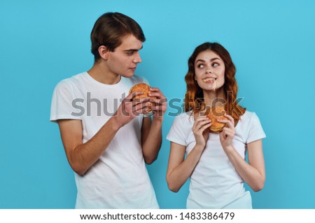Man and woman hamburgers fast food lifestyle eating
