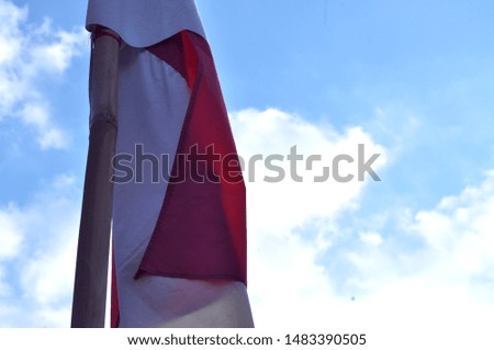 Indonesian Flag with blue sky for background