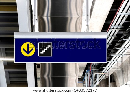 Signboard horizontal in subway or airport with arrow and stairs icons background. It is a signage for public transport.