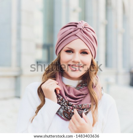 young beauty outdoor portrait with autumn park in background hat.