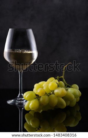 still life white wine with white grapes 