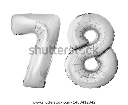 Number 78 seventy eight of silver inflatable balloons isolated on white background. Silver chrome helium balloons forming 78 seventy eight