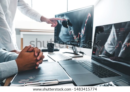 Business Team Investment Entrepreneur Trading discussing and analysis finance market graph stock market trading,stock chart concept Royalty-Free Stock Photo #1483415774