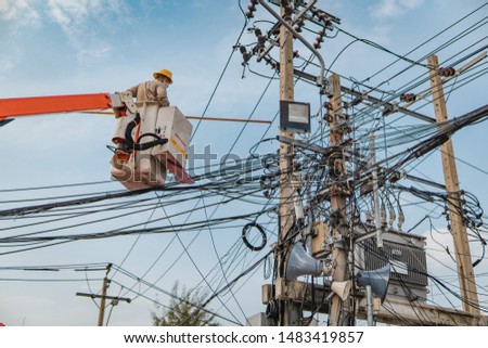 Thailand electricity authority come to fix the electric  pole , Cordage cable, Messy wire