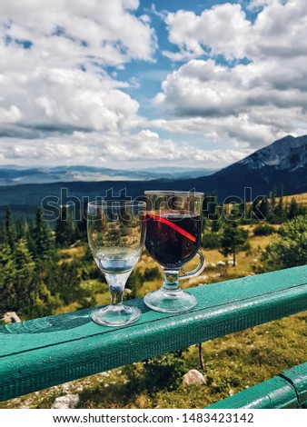 Homemade drinks , clouds and mountain in the background.