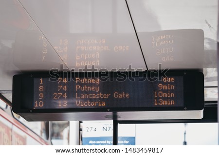 Close up of a upcoming buses schedule on digital screen on a bus stop in London, UK.