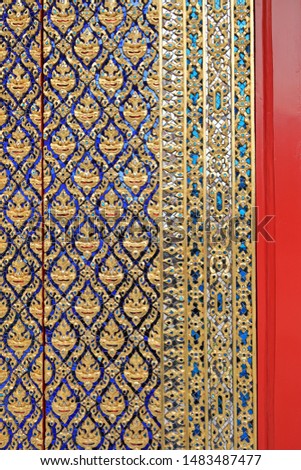 Beautiful pattern of traditional Thai art decorated made from mirror tile at a door of a public Buddhist temple ,textures background 