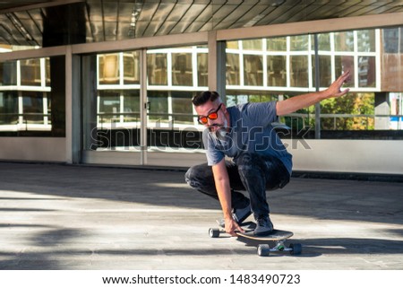 Skater riding a skateboard. Building in the background