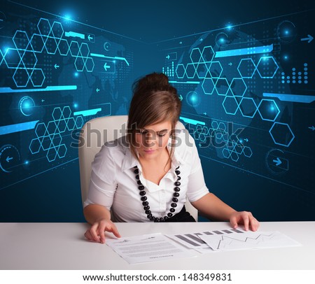 Young businesswoman doing paperwork with futuristic background