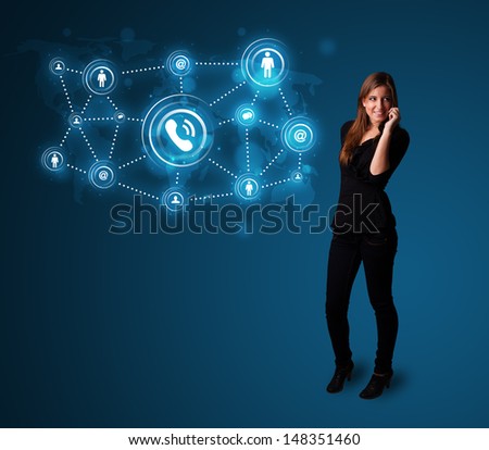 Pretty young girl making phone call with social network icons