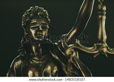 Brass statuette of Justice wearing a blindfold symbolic of fair enforcement of the law