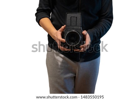 asian photographer taking picture with medium format camera