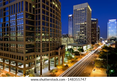 Long exposure photo of the a city street in downtown Phoenix, Arizona at night. Royalty-Free Stock Photo #148355747