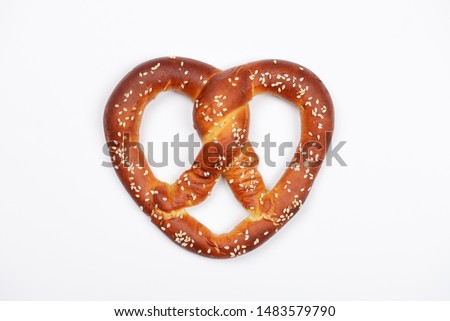 The hand-made pretzel for Octoberfest party on white background Royalty-Free Stock Photo #1483579790