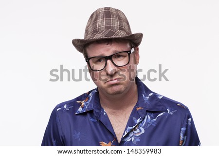 Sad mid adult man in Hawaiian shirt 