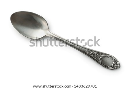 Top view of old silver tea spoon isolated on white Royalty-Free Stock Photo #1483629701