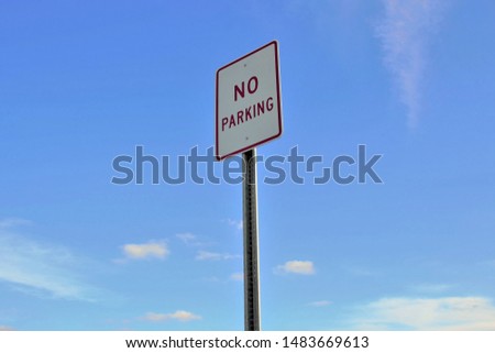 No parking sign with blue sky Royalty-Free Stock Photo #1483669613