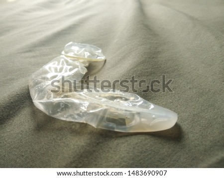 Used condom on the bed, Can prevent communicable diseases, AIDS, HIV, Human Immunodeficiency Virus.