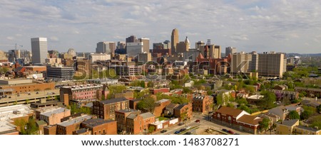 High over the streets buildings and homes in the midwestern town of Cincinnati Ohio USA