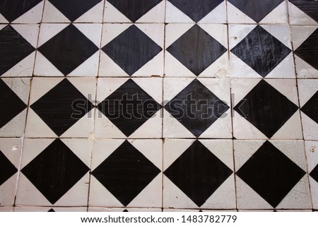 Those tiles remind me of the board of a game of chess