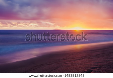 Twilight sky after evening sunrise over the sea horizon, Amazing a great landscape sunset on sand sunny beach with sea, Colorful beauty night sunrise view.