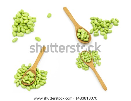 Multi-composition of green fresh soybeans and wooden spoons combined into a creative food material