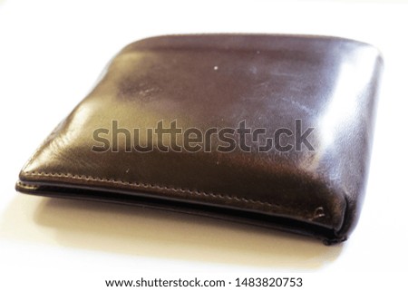 A wallet is a kind of small-sized bag that is commonly used as a means of storing money, credit cards, identity cards, important documents, photos, business cards, and other personal items.