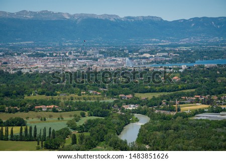 Breathtaking upper view to Geneva, city in Switzerland that lies at the southern tip of expansive Lac Léman (Lake Geneva) and little villages on a border with France. Alps, Jura mountains, Mont Blanc