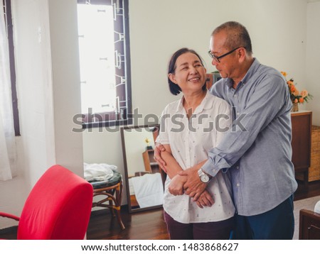 Old couples are showing love for each other,elder man hug elder woman