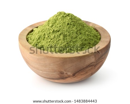 Wooden bowl of henna powder isolated on white