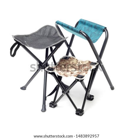 Folding camping stool on white background