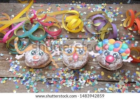 Funny carneval biscuits with smiling faces 