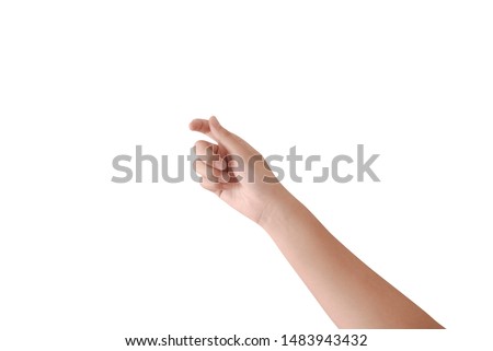 Close up of one beautiful female caucasian hand holding a pointing stick isolated on white background. Anonymous adult woman holds hand as if showing something virtual and invisible between fingers. Royalty-Free Stock Photo #1483943432
