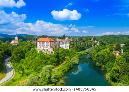 Panoramic view of the river Kupa and Ozalj Castle in the town of Ozalj, Croatia, drone aerial shot
