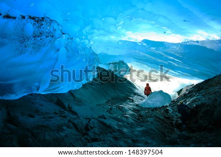 Explorer Inside Ice Cave, Mendenhall Glacier, Juneau, Alaska, USA Royalty-Free Stock Photo #148397504