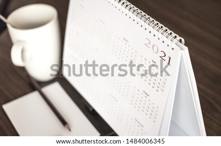 Calendar 2021 schedule with blank note for to do list on wooden desk Royalty-Free Stock Photo #1484006345