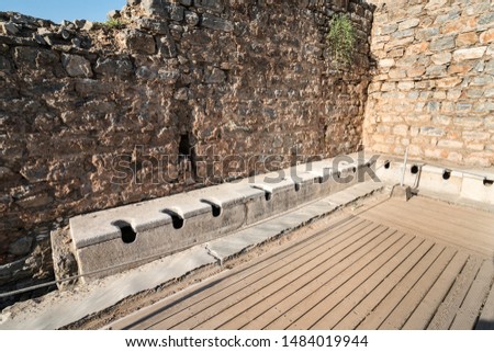 Ancient city Ephesus (Efes). Public multi-seat toilet (seat Latrines) at spectacular antique ruins. Selcuk, Izmir TURKEY