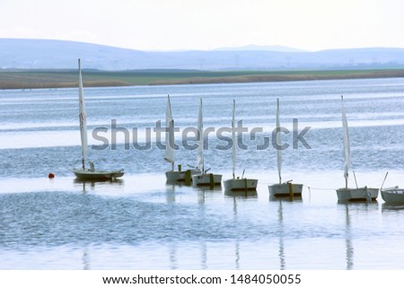 small sailboats on the lake