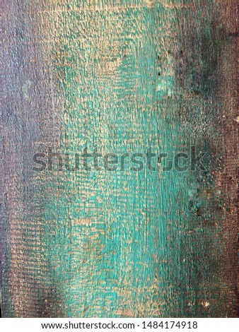 Painted turqoise and green old wooden wall. rustic texture background. Paint peeling 