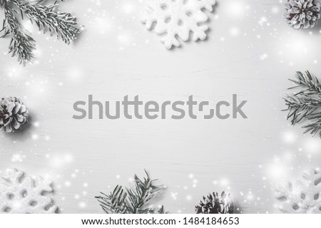 Bright Christmas composition, blank for design - snowflakes, Christmas tree branches and cones, copy space, place for text, flatlay