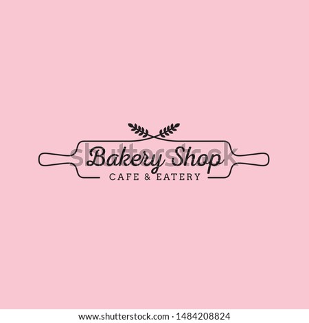 Simple feminine bakery logo design with wheat and wood rolling pin Royalty-Free Stock Photo #1484208824