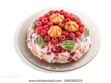 Homemade jelly cake with milk, cookies and raspberry isolated on white background. side view. close up.