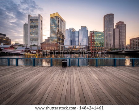 Boston at sunset showcasing its mix of contemporary and historic architecture at Boston Harbor and Financial District.