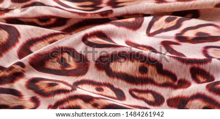 texture, background, pattern. silk fabric, tiger skin, light and silky soft, this atlas charmeuse is perfect for your projects - especially on bias. Colors include tan, black and brown.