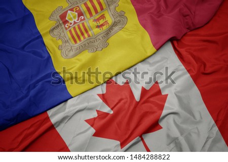 waving colorful flag of canada and national flag of andorra. macro