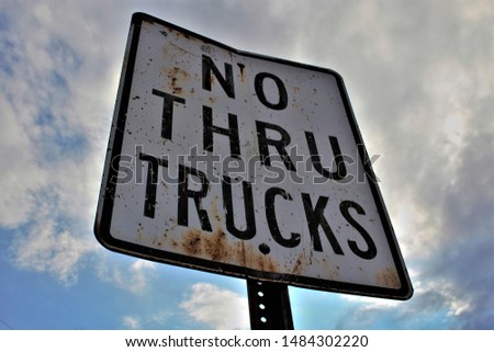 No thru trucks with cloudy sky Royalty-Free Stock Photo #1484302220
