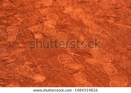 Footprints on a clay tennis court 