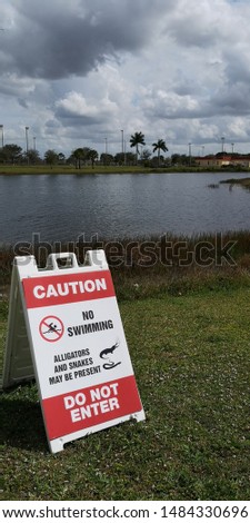 caution snakes and crocodiles sign