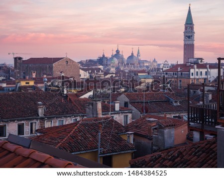 Sunset on the rooftops of Venice with the cathedral and the campanile in the background
